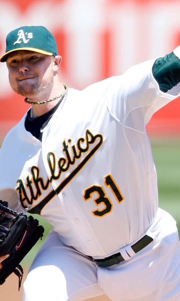 Lester beats Royals in A's debut with help from Gomes